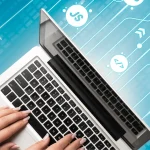 Hands on laptop with digital HTML and JS icons – hybrid app development company in Bangalore